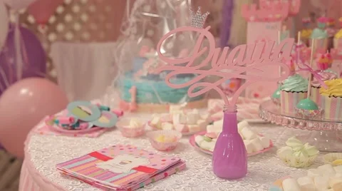 Sweets and decorations on the table to celebrate 1 year baby Stock Footage 63783396