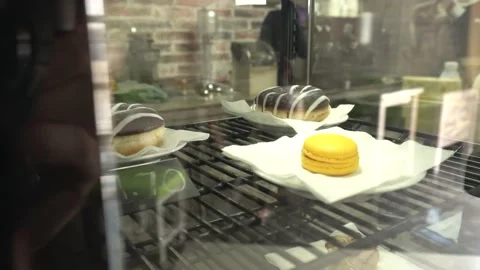 Sweets are sold in the store on a display window croissants, cakes and muffins Stock Footage 131323895