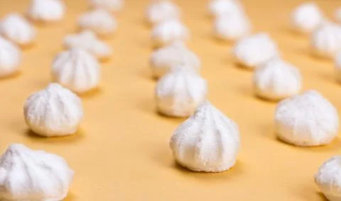 Sweets on a beautiful pastel surface in a minimalist style. Stock Photos
