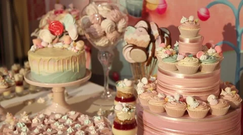 Sweets cake cakes and marshmallows on the table Stock Footage 64289700