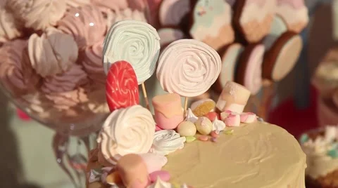 Sweets cake cakes and marshmallows on the table Stock Footage 64290198