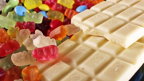 Sweets. Chocolate candies candy texture gum gummy bears bear and bonbons Stock Footage 98790400