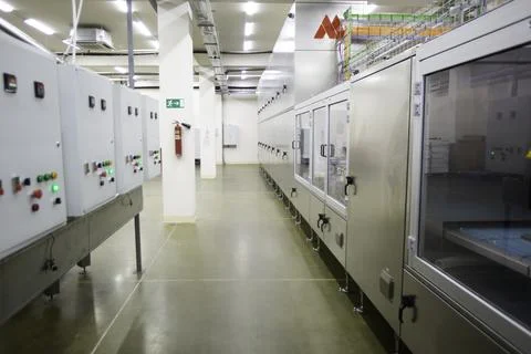 Sweets factory. Sweets production process. Conveyor belt with sweets on it. Stock Photos