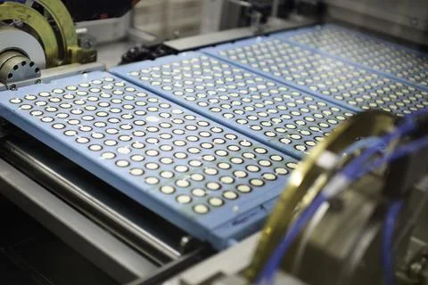 Sweets factory. Sweets production process. Conveyor belt with sweets on it. Stock Photos