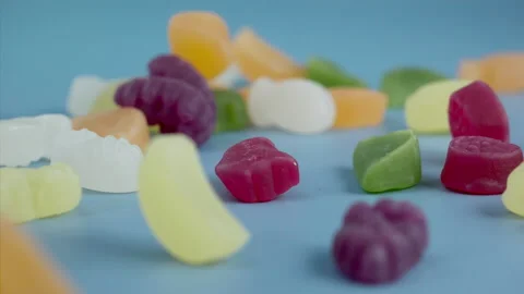 Sweets falling on a pastel background . Super slow motion 1000 fps Stock Footage 281562082