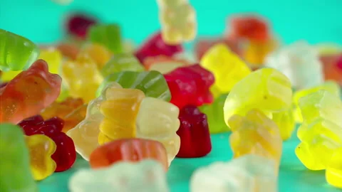 Sweets falling on a pastel background . Super slow motion 1000 fps Stock Footage 281562222