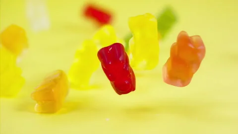 Sweets falling on a pastel background . Super slow motion 1000 fps Stock Footage 281562232