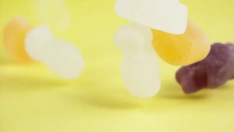 Sweets falling on a pastel background . Super slow motion 1000 fps Stock Footage 281562400