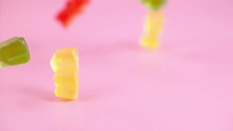 Sweets falling on a pastel background . Super slow motion 1000 fps Stock Footage 281562402