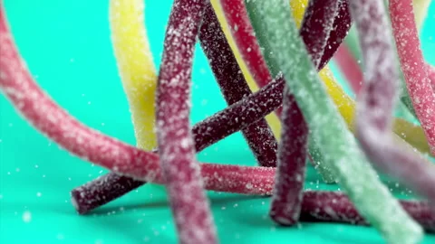Sweets falling on a pastel background . Super slow motion 1000 fps Stock Footage 281562673