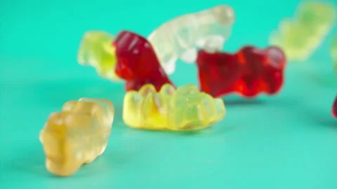 Sweets falling on a pastel background . Super slow motion 1000 fps Stock Footage 281562956