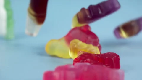 Sweets falling on a pastel background . Super slow motion 1000 fps Video stock 281563064