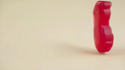 Sweets falling on a pastel background . Super slow motion 1000 fps Stock Footage 281563164