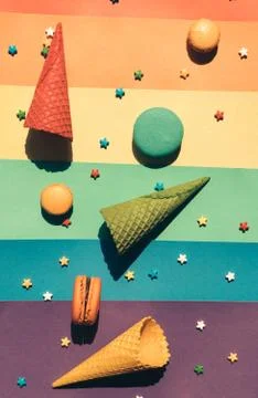 Sweets on a multi-colored striped background in order of the colors of the ra Foto stock