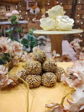 Sweets piled up on a decorative table Stock Photos