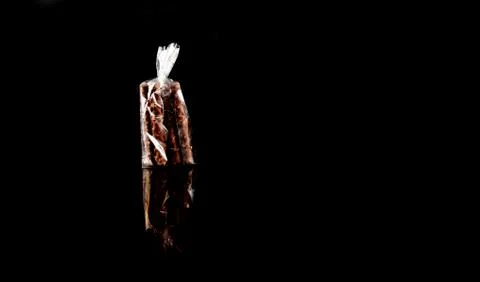 Sweets in plastic food packaging with reflection and copy space Foto stock