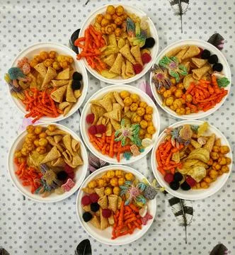 Sweets on the plates on the table Stock Photos