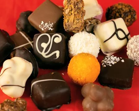 Sweets on a red background. Stock Photos