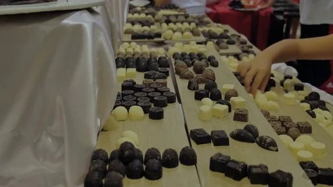 Sweets on the table. Buffet, sweet bar with black and white chocolate. Stock Footage 81315123