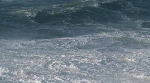 Swelling waves rolling toward the camera and exploding in foam 動画素材 59130731