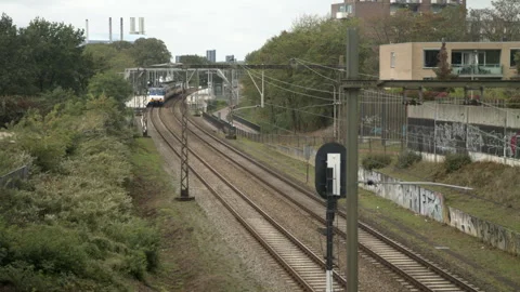 Swift Departure: Dutch Sprinter Train Races Onward Video stock 240984217