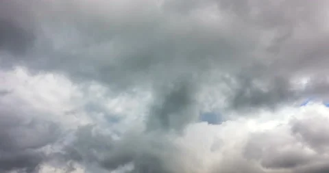 The swift whirling motion of the clouds across the blue sky. Timelapse. 4K Stock Footage 120619602