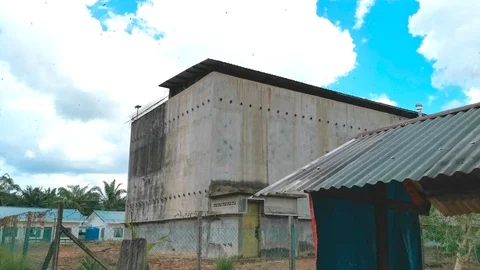 Swiftlets House Exterior Extreme Long Shot (Edible Bird Nest Industry) Stock Footage 106913980