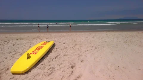 Swim between the flags at the beach, New Zealand Video stock 128565132
