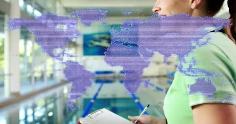 Swim coach observing pool as blocking clipboard glare and jotting notes with Stock Footage 317835745