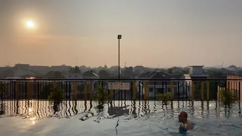 Swim during sunrise Stock Footage 242096296