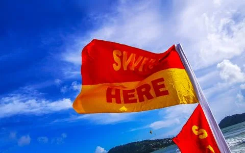 Swim Here Beach Flag Marking Safe Swimming Area Thailand. Stock Photos