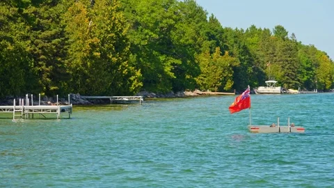 Swim platform with flag or swimming raft situated at resort waters on Lake .. Stock Footage 258793937