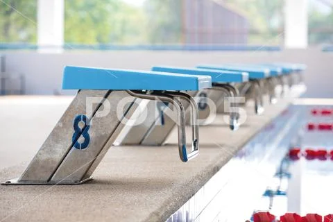 Swiming pool and jumping stand Stock Photos