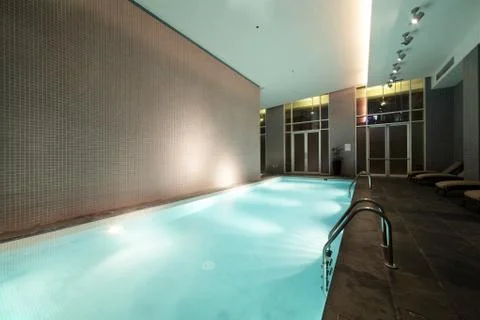 Swiming pool inside building Stock Photos