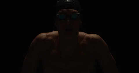 Swimmer against a black background Stock Footage 283041147