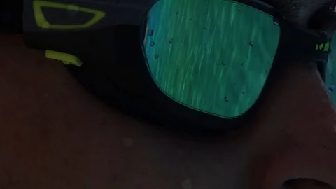 Swimmer closeup on glasses reflection at pool Stock Footage 90124719