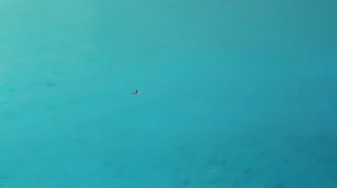 Swimmer in deep blue waters Stock Footage 24738498