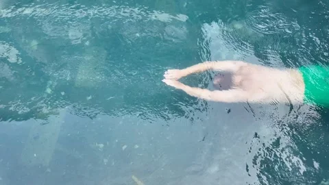 Swimmer Diving into Clear Blue Water Stock Footage 291392993