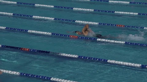 Swimmer doing laps in an outdoor lap swimming pool Stock Footage 104839006
