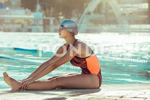 Swimmer doing warmup workout before training Stock Photos