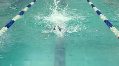 Swimmer floats in the pool Stock Footage 57363797