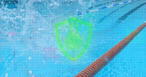 Swimmer launching dive from starting block at pool, creating water plume for Stock Footage 315546618