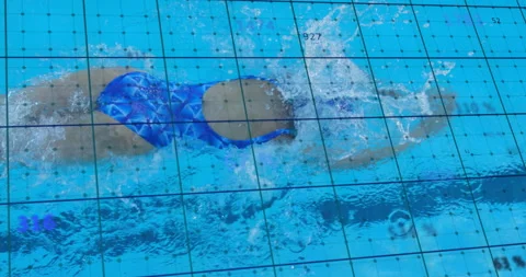 Swimmer launching freestyle in pool by lifting arm, showing grid overlay for Stock Footage 315565721