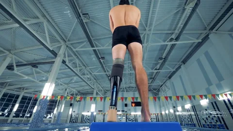 A swimmer with a leg prosthesis, bottom view. Stock Footage 99533931