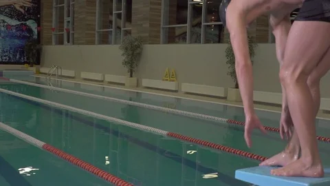 Swimmer makes a leap into the pool Stock Footage 91299041