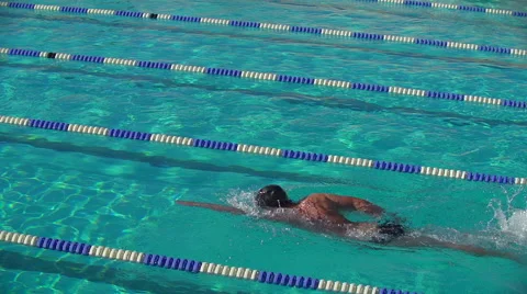 Swimmer performs front crawl in lanes of swimming pool Vídeos de archivo 52730836