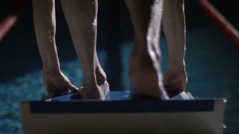 Swimmer in the pool jumping into the water Stock Footage 132894445