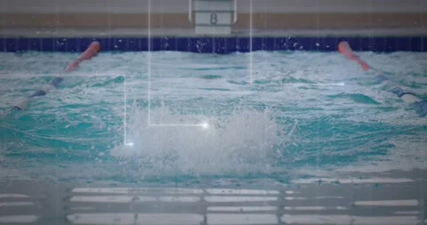 Swimmer pushing off lane eight and racing butterfly stroke in swim meet creating Video stock 327901072