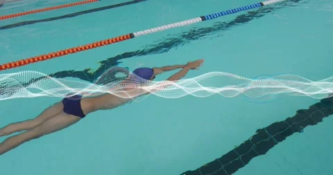 Swimmer pushing off pool wall, gliding underwater into front crawl with wave Video stock 328150959