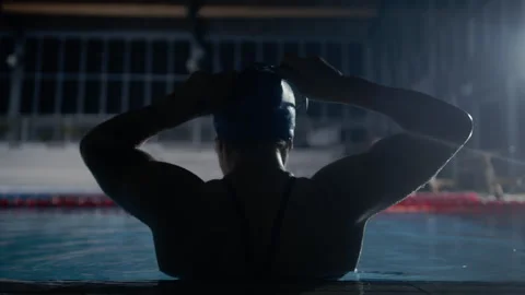 Swimmer putting her goggles on Stock Footage 275617890